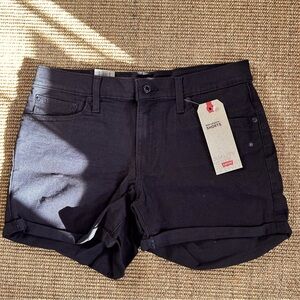 Levi’s black mid-length denim shorts. Size 12. NWT.